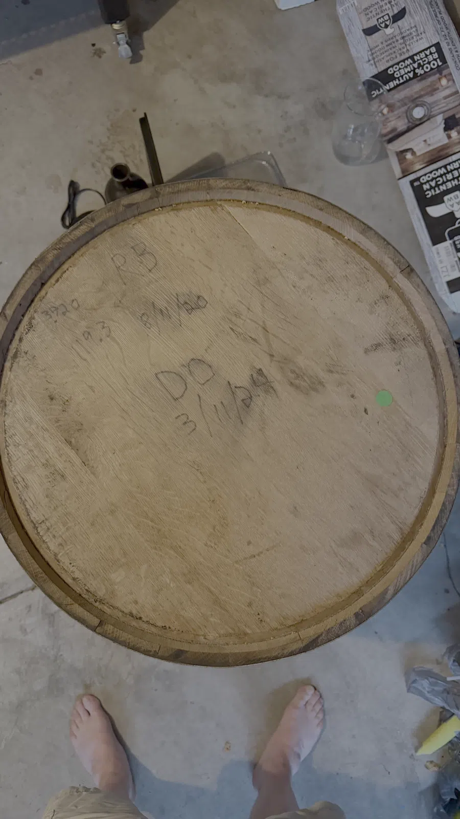 The barrel head, carrying the record of its earlier life.